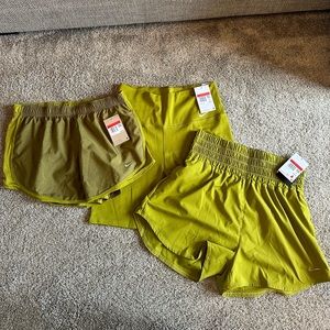 Three pairs of olive green Nike shorts, new with tags, size large.